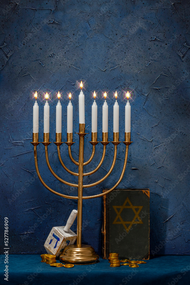 Jewish Hanukkah Menorah, book with star of David, dreidel. Holiday Candle Holder, dreidl, Talmud, or Torah. Nine-arm candlestick. Traditional Hebrew Festival of Lights candelabra. Сopy space