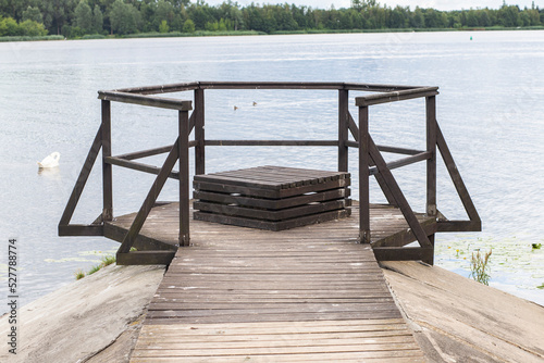 wooden bridge over blue lake