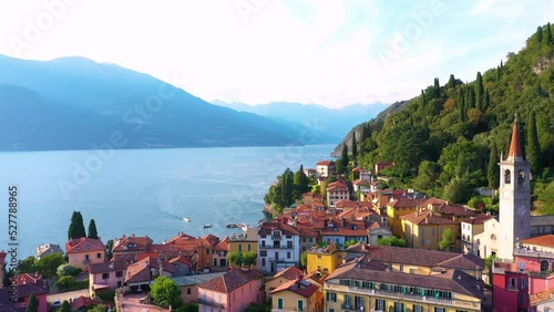 Village of Varenna on Como lake in Italy. Varenna by Lake Como in Italy, aerial view of the old town with the church of San Giorgio in the central square. Famous mountain lake in Italy photo