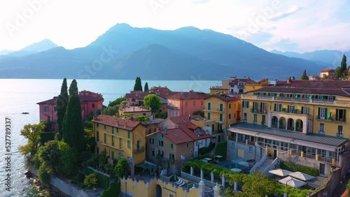 Village of Varenna on Como lake in Italy. Varenna by Lake Como in Italy, aerial view of the old town with the church of San Giorgio in the central square. Famous mountain lake in Italy photo