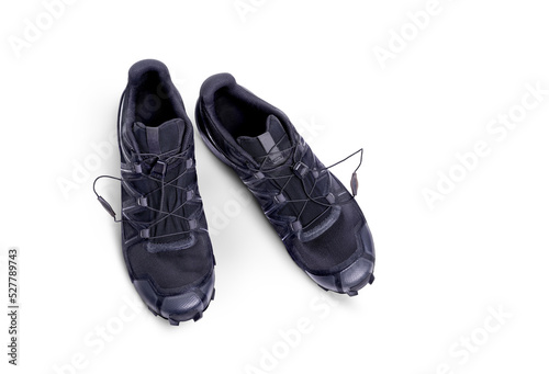 Obraz na płótnie A top view of black trainers, sneakers Isolated on a flat background. w salonie