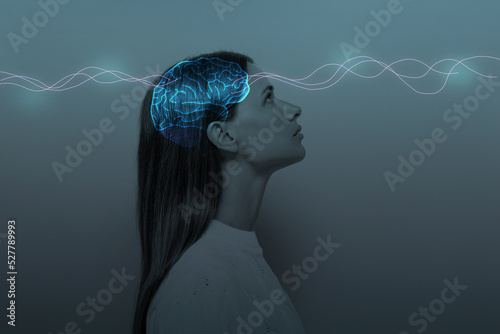 Young girl with closed eyes and neon glowing brain. Women's Mental Health and Meditation photo
