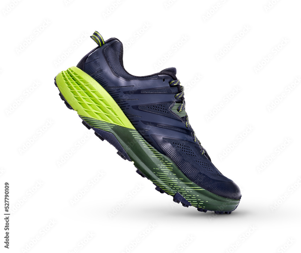 A front view of black and green trainers, sneakers Isolated on a flat background.
