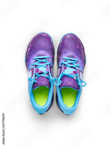 Obraz na płótnie A top view of blue and purple trainers, sneakers Isolated on a flat background. w salonie