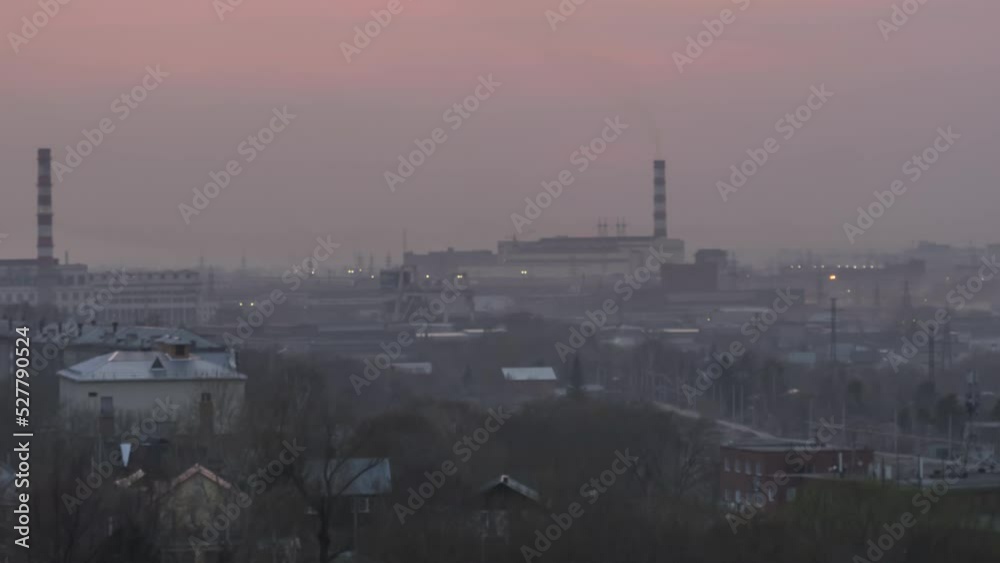 Sunset in an industrial gray dusty city, timelapse. Sun went down, fog or rain Sunset in an industrial gray dusty city, timelapse. Sun went down, fog or rain