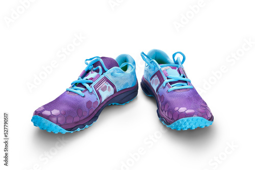 Obraz na płótnie A front view of blue and purple trainers, sneakers Isolated on a flat background. w salonie