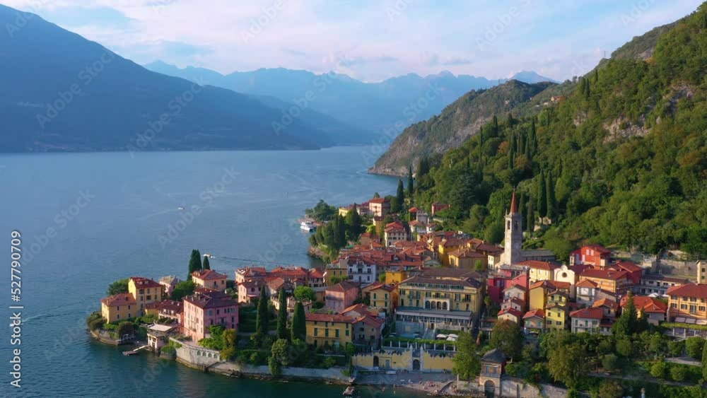 Village of Varenna on Como lake in Italy. Varenna by Lake Como in Italy, aerial view of the old town with the church of San Giorgio in the central square. Famous mountain lake in Italy Village of Varenna on Como lake in Italy. Varenna by Lake Como in Italy, aerial view of the old town with the church of San Giorgio in the central square. Famous mountain lake in Italy