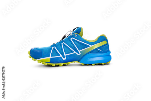 Obraz na płótnie A side view of blue and yellow trainers, sneakers Isolated on a flat background. w salonie