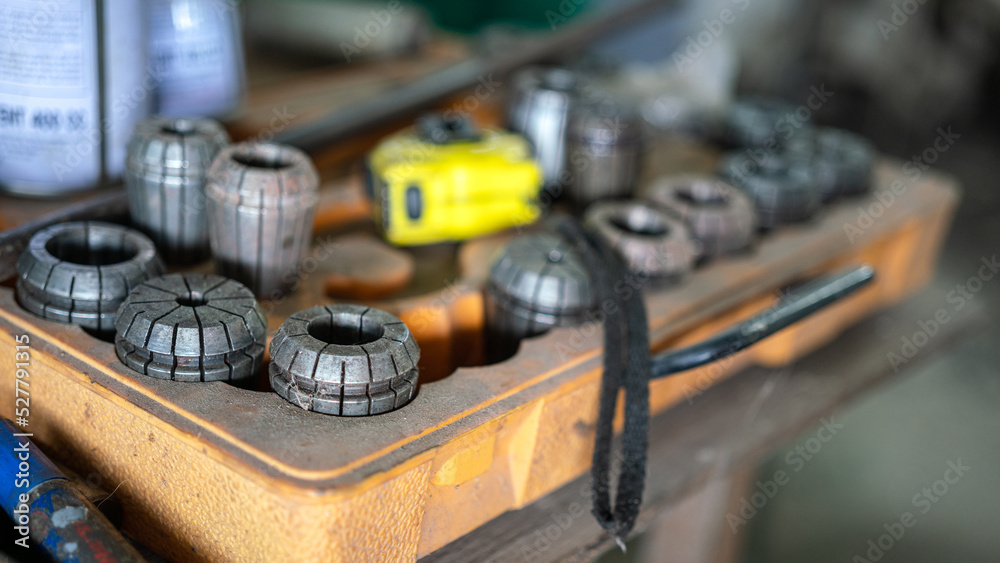 Steel CNC machinery milling head in toolbox. Industrial equipment object photo, Close-up and selective focus at the metal piece surface. Steel CNC machinery milling head in toolbox. Industrial equipment object photo, Close-up and selective focus at the metal piece surface.