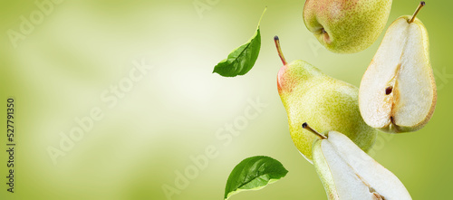 pear with slices and leaves  flying on green background