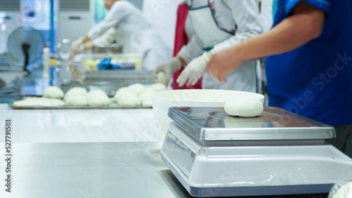 masters prepare food by rolling dough