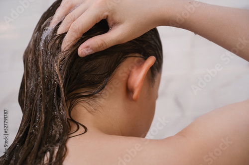 Closeup of the female washing her hair