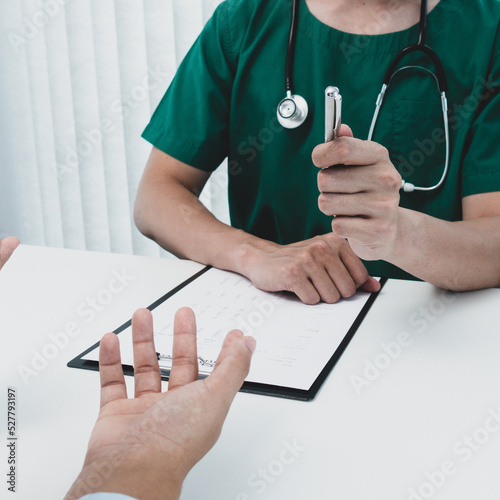 Specialist doctors advise and examine the history of patients in a direct health room at a modern hospital, Annual Health Check and Health Care Report concept.