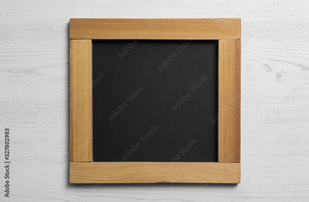 Blank chalkboard on white wooden background, top view. Space for text