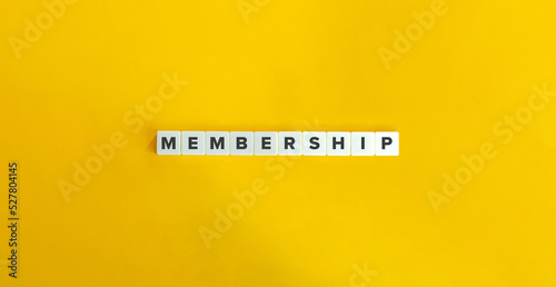 Membership Word on Letter Tiles on Yellow Background. Minimal Aesthetics. photo