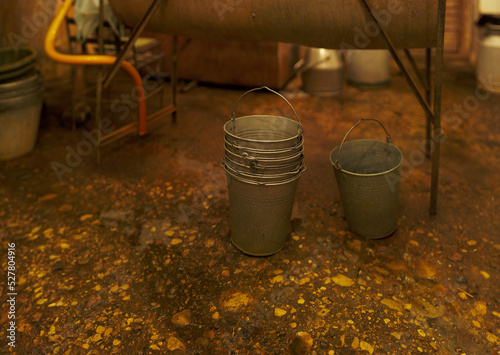 A pile of metal buckets industrial farm scene
