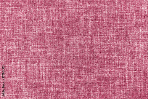 Texture of natural pink upholstery fabric or cloth. Fabric texture of natural cotton or linen textile material. Blue canvas background. Decorative fabric for curtain, furniture, walls, clothes