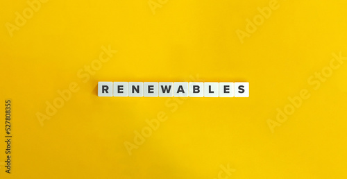 Renewables Word on Block Letter Tiles on Yellow Background. Minimal Aesthetics.