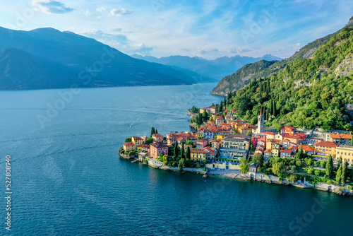 Village of Varenna on Como lake in Italy. Varenna by Lake Como in Italy, aerial view of the old town with the church of San Giorgio in the central square. Famous mountain lake in Italy photo