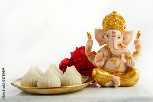 Obraz na płótnie Idol of lord Ganesha with Modak Sweet Dish and flower
