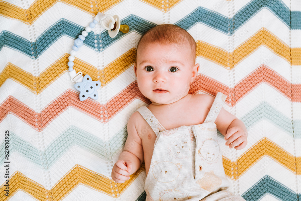 Calm cute baby resting in crib Calm cute baby resting in crib