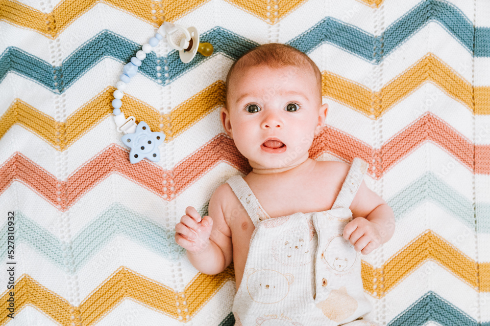 Calm cute baby resting in crib Calm cute baby resting in crib
