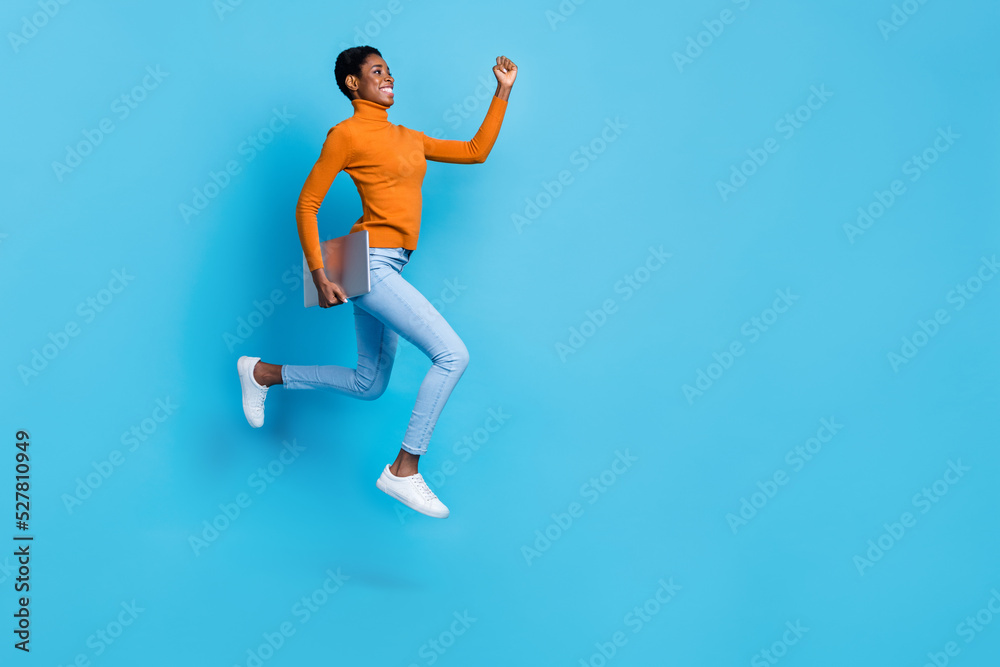Full size profile side photo of cheerful trans nonbinary businesswoman running to close deadline isolated on blue color background