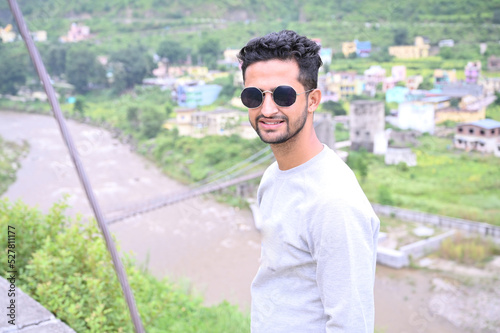 a young man smiley face with blurred background.