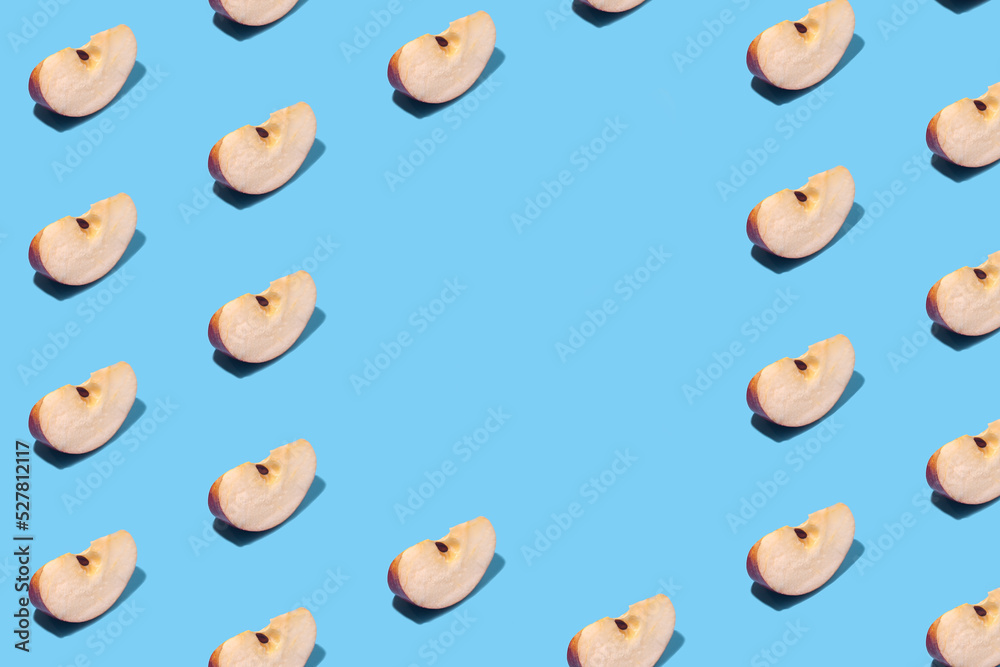 Apple slices on a blue background
