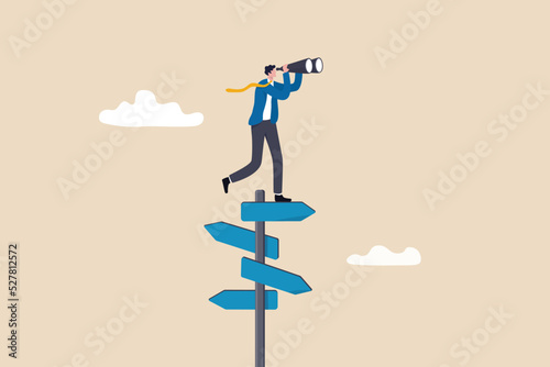 Search for right direction, business opportunity or success way, make decision or career path, vision to see future concept, smart businessman look through spyglass or binoculars to discover solution. photo