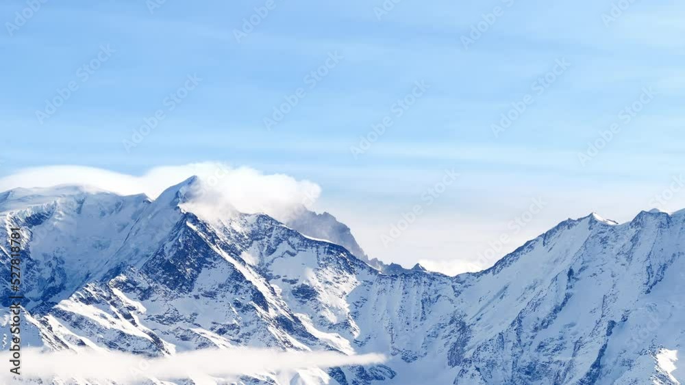 Mountain in French Alps Mont Blanc massif with thick clouds Mountain in French Alps Mont Blanc massif with thick clouds