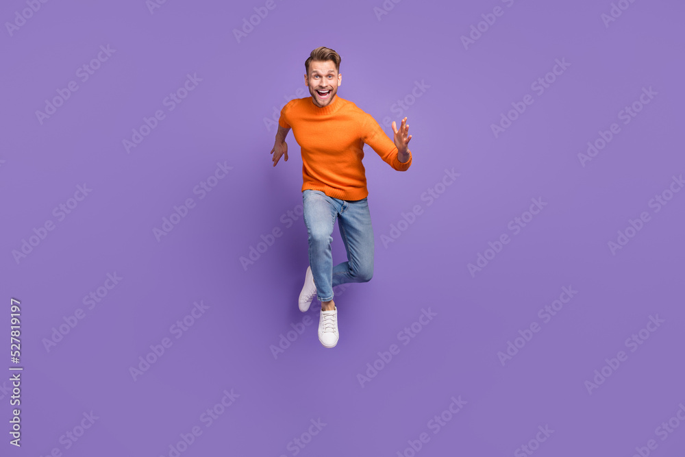 Full body photo of overjoyed laughing man enjoy summer vacation isolated on purple color background Full body photo of overjoyed laughing man enjoy summer vacation isolated on purple color background