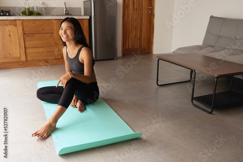 Yoga At Home. Asian Woman Relaxing Up Before Exercising. Young Female Sitting On Floor And Going To Practice. Sport Routine For Staying Calm