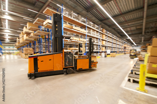 Forklift transporting boxes in a warehouse