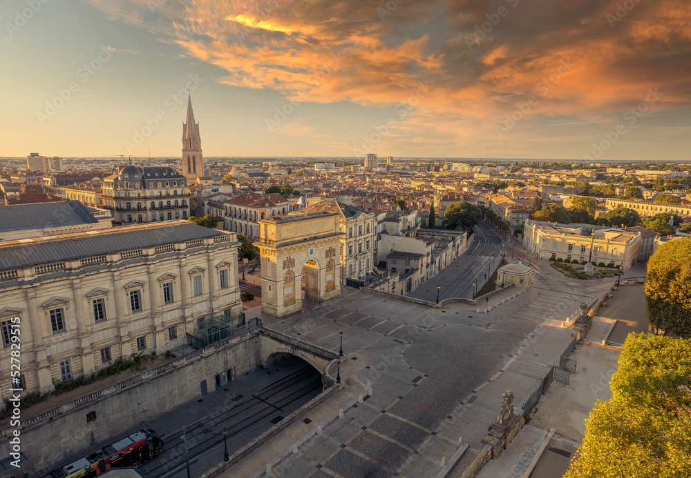 Aerial view of The Porte du Peyrou and  Montpellier city at sunrise, France. The Porte du Peyrou is a triumphal arch in Montpellier, in southern France. - obrazy, fototapety, plakaty 