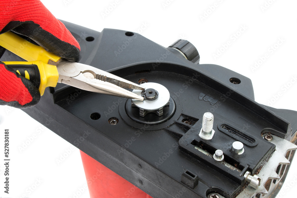 disassembled electric chain saw, chainsaw repair, close-up on a white isolated background