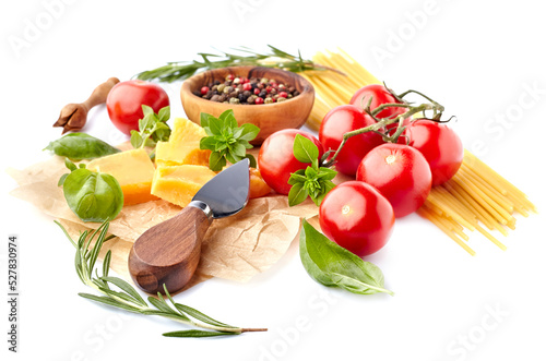 Fresh tomatoes with spaghetti, basil leaves, rosemary, pepper and cheese isolated on white background. Ripe tomatoes with spices.