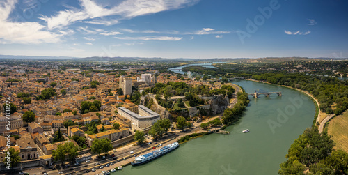 Saint Benezet bridge and Rhone river aerial panoramic view in Avignon, France. Avignon is the prefecture of the Vaucluse department in the Provence-Alpes-Côte d'Azur region of Southeastern France.