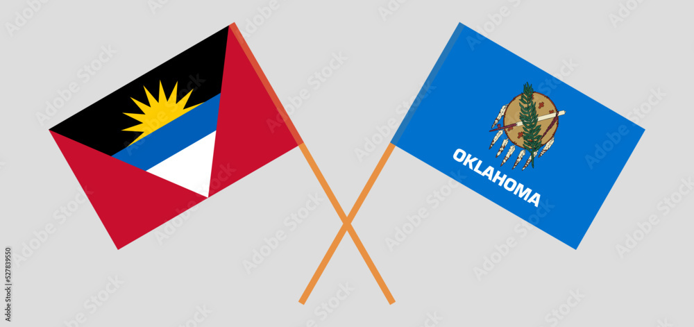 Crossed flags of Antigua and Barbuda and The State of Oklahoma. Official colors. Correct proportion Crossed flags of Antigua and Barbuda and The State of Oklahoma. Official colors. Correct proportion