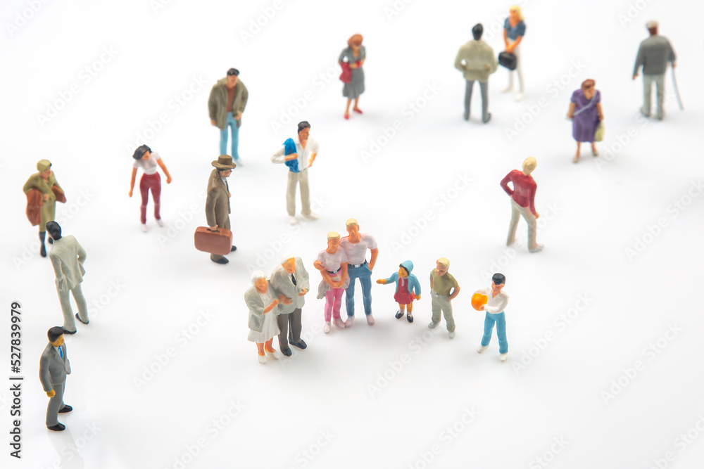 miniature people. different people stand on a white background. communication of society of different generations miniature people. different people stand on a white background. communication of society of different generations