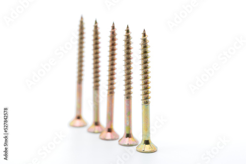 Screws in a close up from the side, wood screws, white background, cropped image