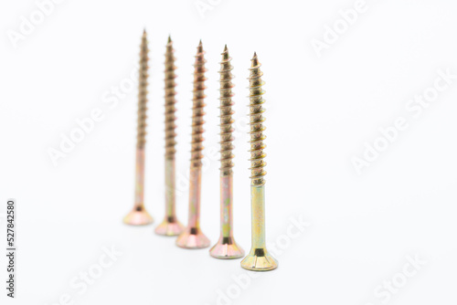 Screws in a close up from the side, wood screws, white background, cropped image