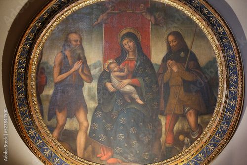 Sant'Ambrogio's basilica, Milan. Chapel of the Madonna of Help. Madonna between SS. Jerome and Rocco Image attributed to the school of Bernardino Luini (ca. 1485-1532). photo