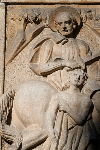 Relief sculpture depicting Saint martin giving half his coat..