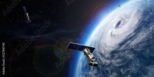 Planet earth with cyclone. Perfect storm. Hurricane seen from space. Satellites around the world. 3D rendering.