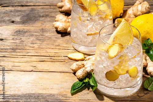 Refreshment Ginger Ale cocktail, Kombucha or Lemon Ginger iced lemonade drink. Sweet and sour alcohol drink copy space