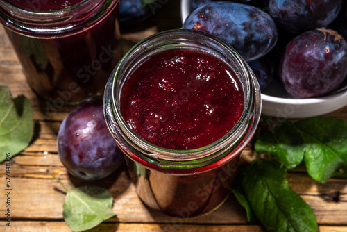 Homemade plum jam in small jar