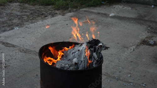 Dumpster Fire Large Orange Flames Lick Out of Trashcan Fire photo