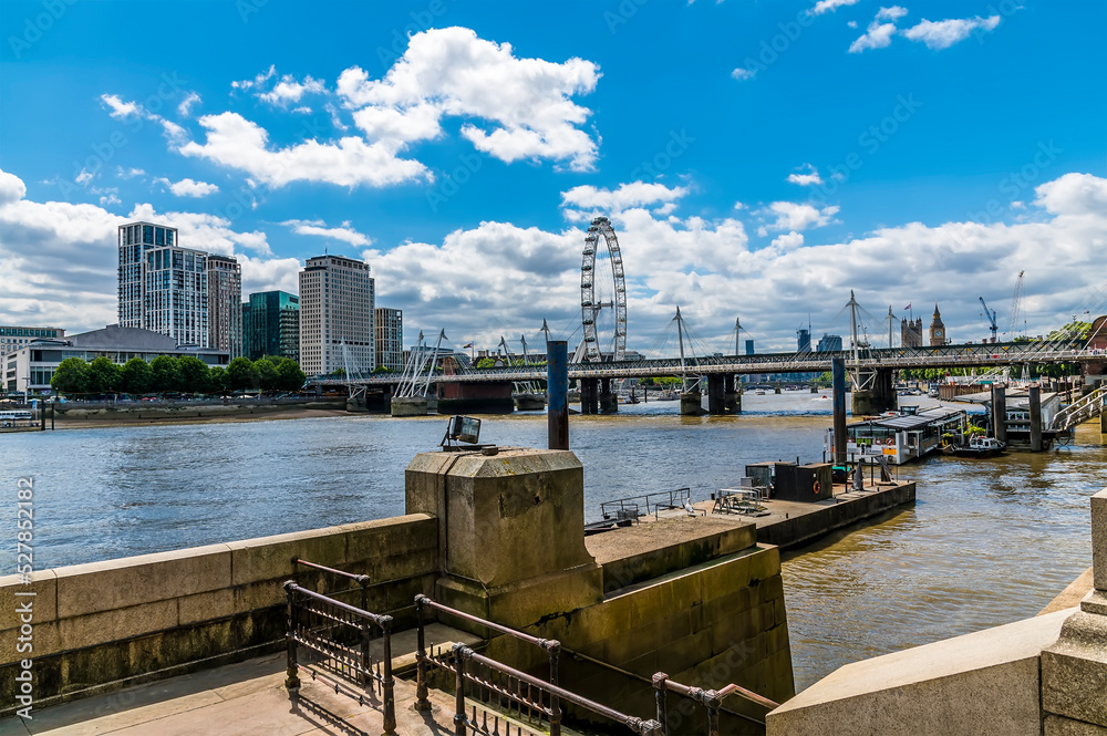 A view from the Embankment beside Waterloo bridge along the River Thames in London, UK in summertime