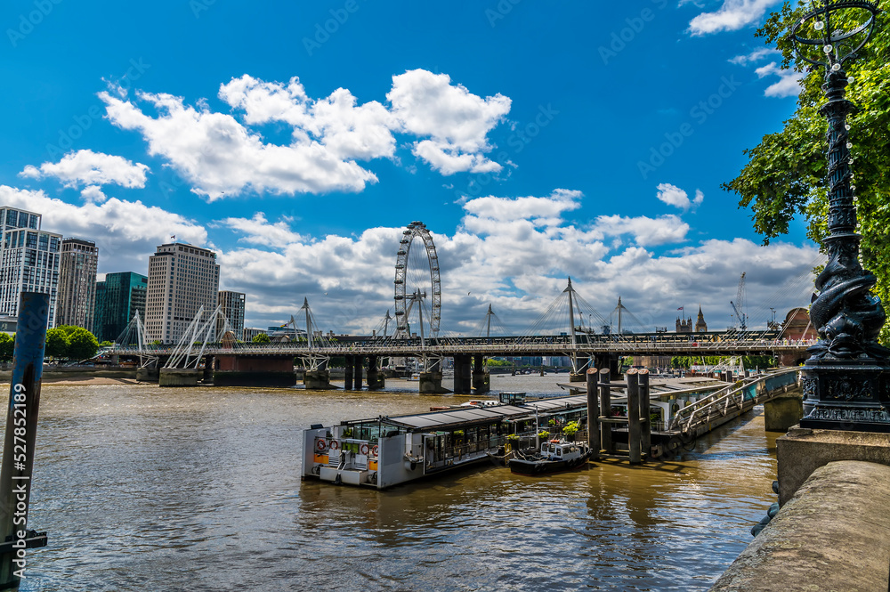 A view from the Embankment along the River Thames towards Westminster in London, UK in summertime